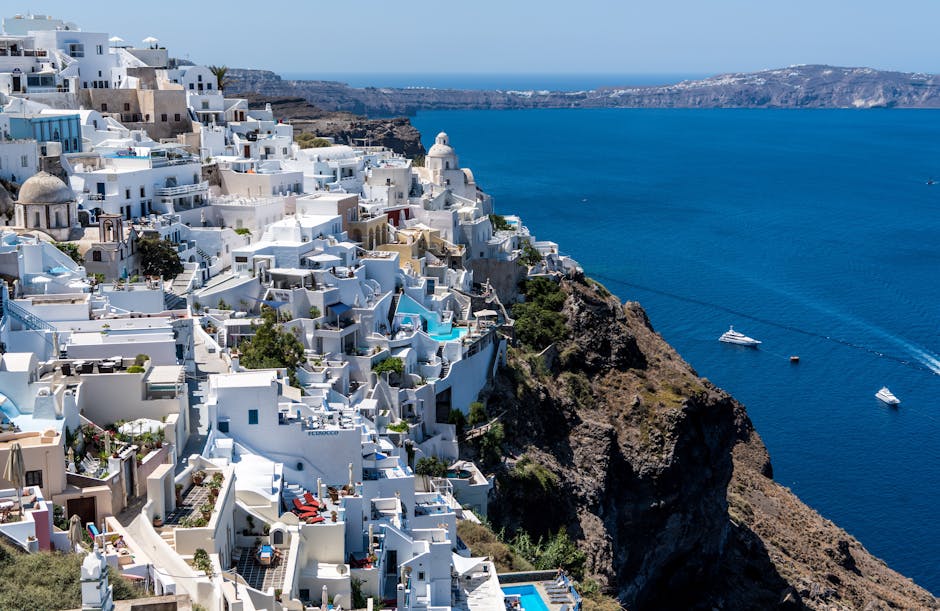 Explore breathtaking Santorini with white-washed buildings overlooking the Aegean Sea.