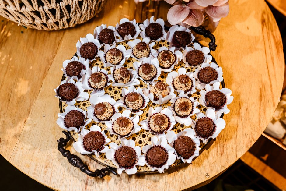 A luxurious assortment of gourmet chocolate truffles arranged on an ornate tray, perfect for indulgence.